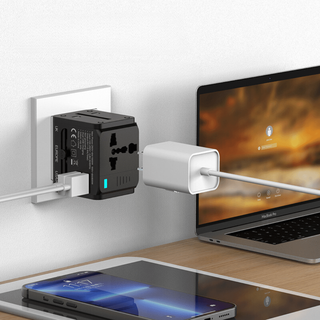 Modern workspace featuring a laptop and smartphone connected to a sleek charger.
