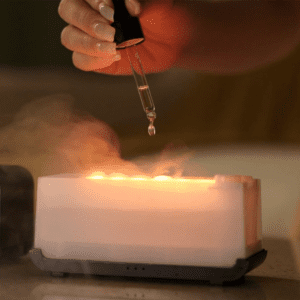 Elegant aromatherapy diffuser with essential oil dropper for mindfulness and relaxation in a cozy space.