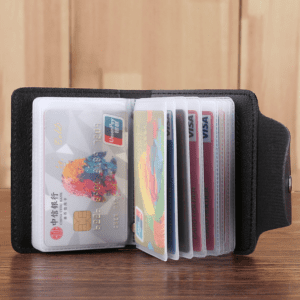 Sleek black cardholder wallet with colorful credit cards organized in transparent sleeves.