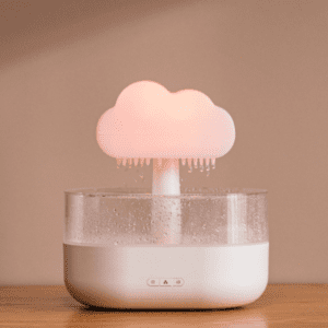 Whimsical pink cloud humidifier lamp for childrens rooms and modern decor.
