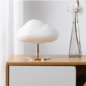 Stylish cloud lamp decor on wooden table with flowers, perfect for modern home interiors.
