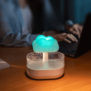 Whimsical cloud lamp humidifier enhances cozy workspace with soothing aqua light and modern design.