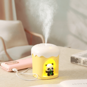 Whimsical cupcake humidifier with panda figurine, perfect for cozy home decor or office relaxation.