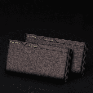 Elegant black and brown leather wallets showcasing luxury craftsmanship and minimalist design.