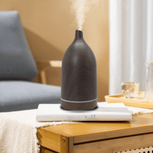 Stylish essential oil diffuser in a cozy living space enhances wellness and relaxation.