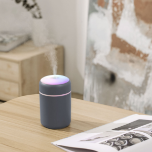 Modern aromatherapy diffuser on a wooden table, enhancing relaxation and wellness in stylish spaces.