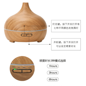 Elegant teardrop essential oil diffuser with wood finish, perfect for home aromatherapy and ambiance.