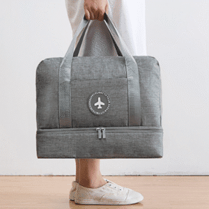 Stylish gray travel bag with airplane emblem, perfect for weekend getaways and casual trips.