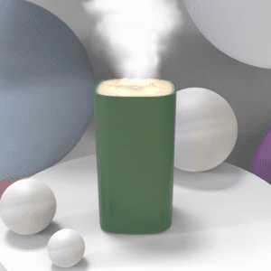 Modern green cup with steaming drink and colorful spheres on a minimalist table.