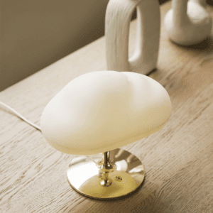 Stylish modern minimalist lamp design with a soft glow and elegant brass base.
