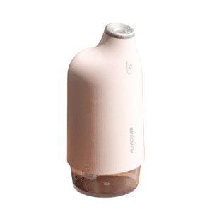 Sleek pastel pink humidifier enhances air quality, perfect for modern home and office decor.