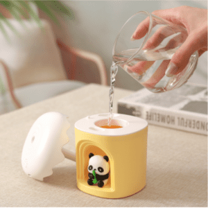 Bright yellow panda water dispenser, a playful desk accessory for home or office use.