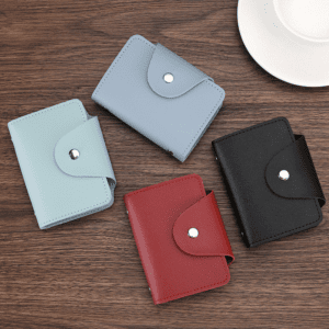 Stylish synthetic leather wallets in four colors displayed on a wooden surface for everyday use.